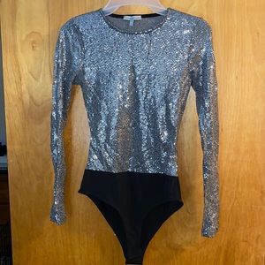 Sparkly glitter bodysuit Taylor Swift mirrorball eras tour inspo NewYears outfit